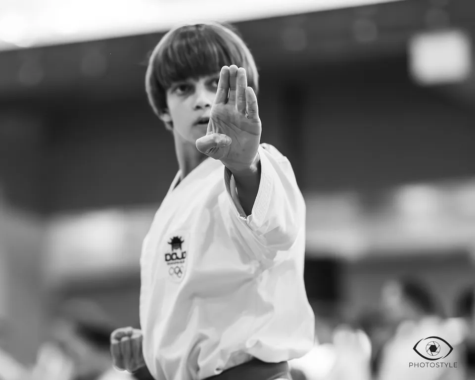 Kata: a young athlete in stance, black and white