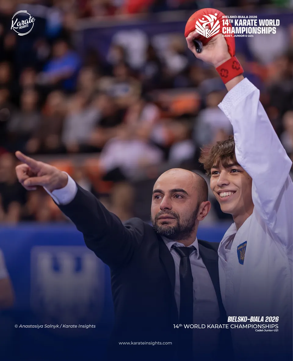A coach and an athlete celebrate a point at the 2026 World Championships
