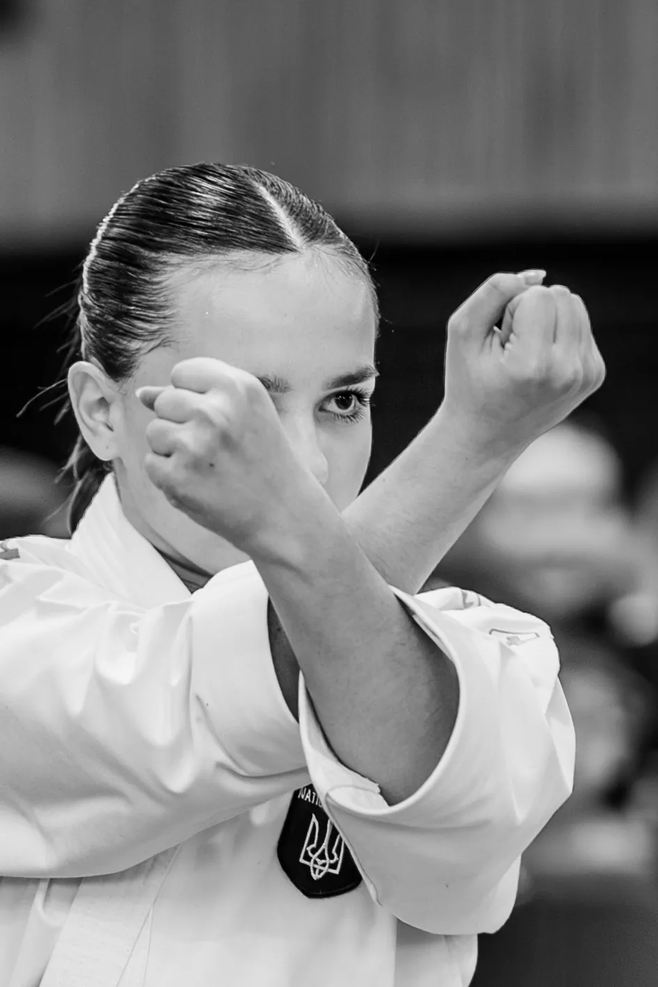 Kata: a crossed-arm stance, black and white